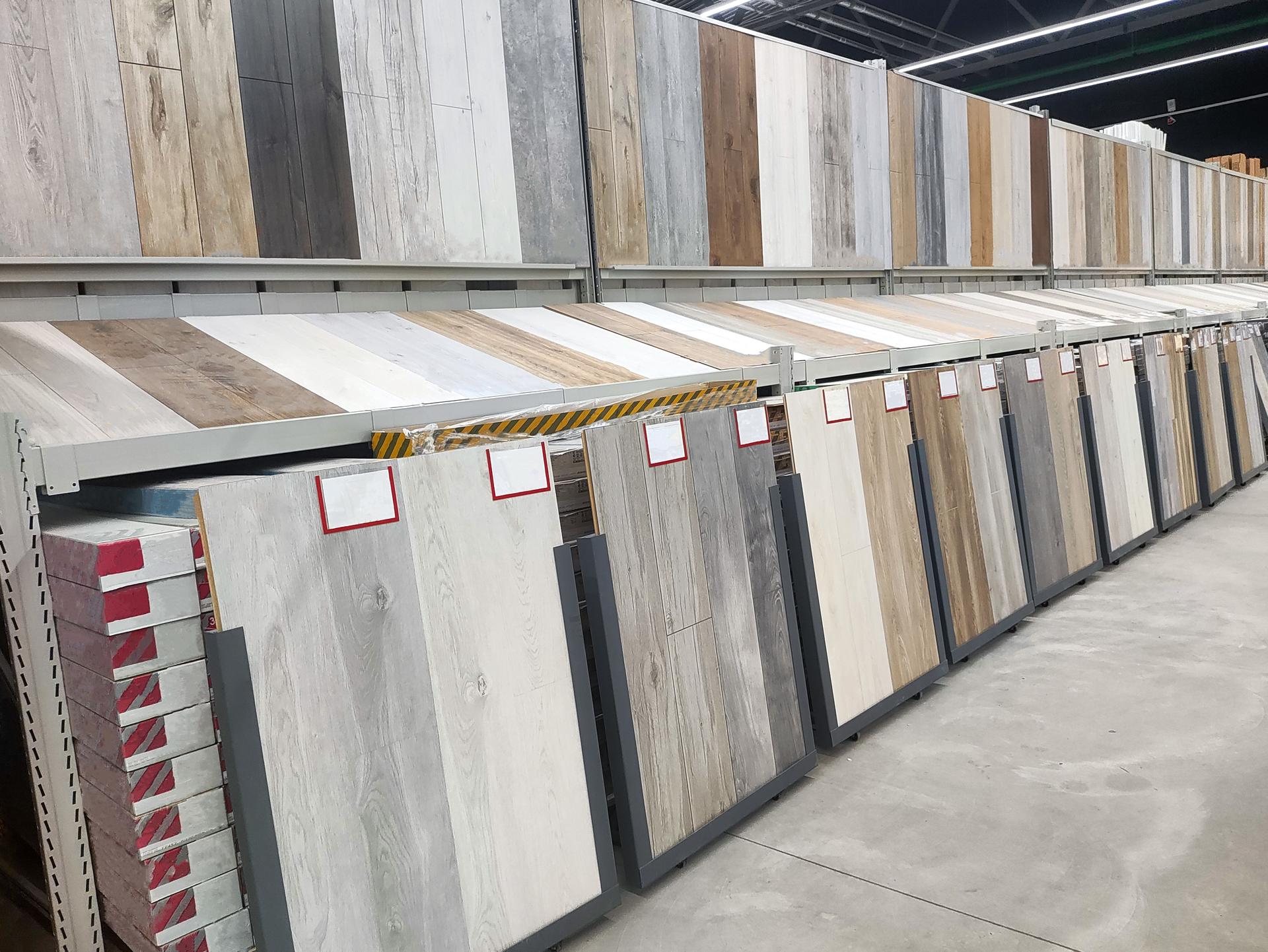 Selling laminate flooring in a building materials store, inside. Copy space for text